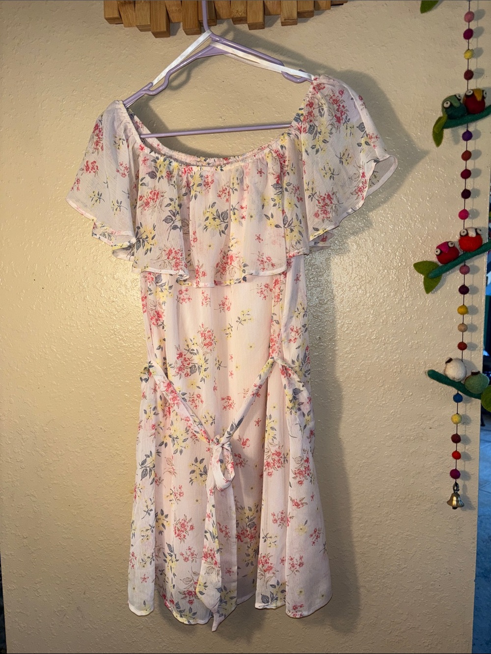 NWOT BLUE RAIN off-the-shoulder light pink floral dress featuring a prominent ru